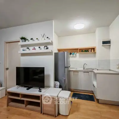 Modern compact living room with integrated kitchen and stylish decor