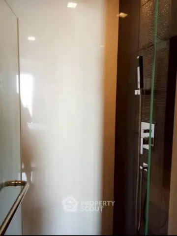 Modern bathroom with sleek shower design and glass door