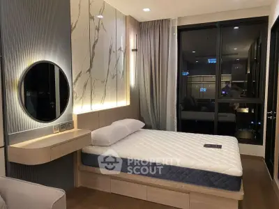 Modern bedroom with stylish decor and large window offering city views.