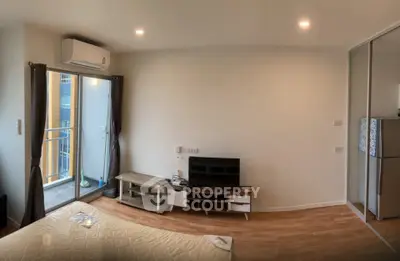 Modern bedroom with balcony access and sleek interior design