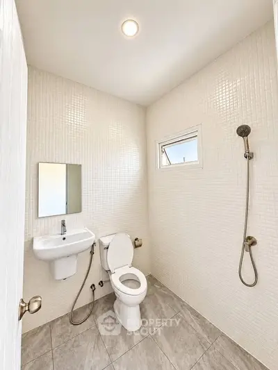 Modern minimalist bathroom with sleek fixtures and neutral tiles