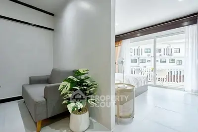 Modern bedroom with balcony access and stylish decor