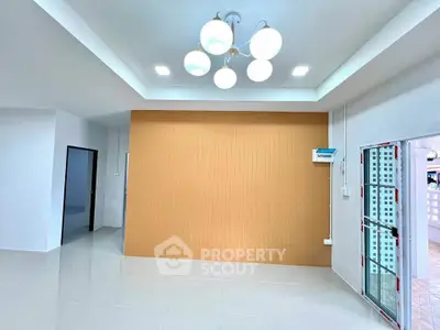Modern interior with stylish lighting and sleek tile flooring, perfect for contemporary living.