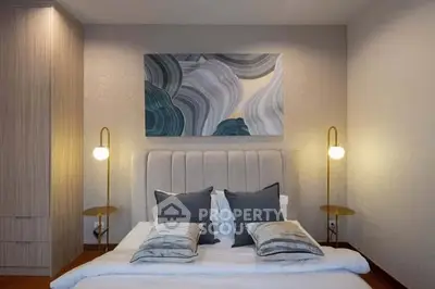 Modern bedroom with stylish decor and cozy lighting