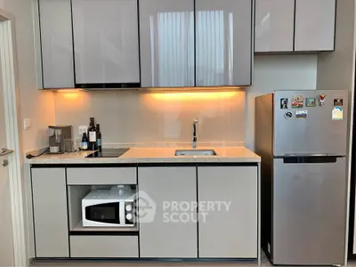 Modern kitchen with sleek cabinetry and stainless steel appliances