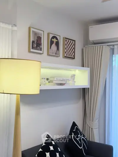 Stylish living room with modern decor, wall art, and cozy lighting