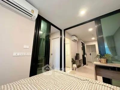 Modern bedroom with air conditioning and stylish decor in a contemporary apartment.