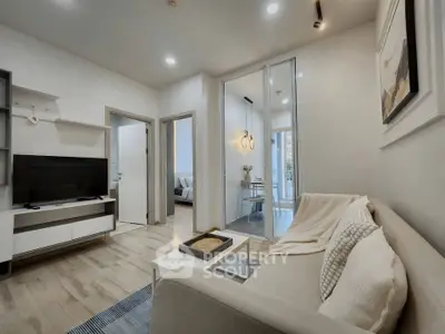 Modern living room with cozy sofa and stylish decor in a contemporary apartment.