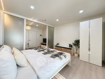 Modern bedroom with sleek design and ample natural light