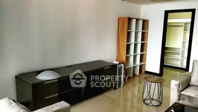 Spacious living room with modern furniture and sleek shelving unit