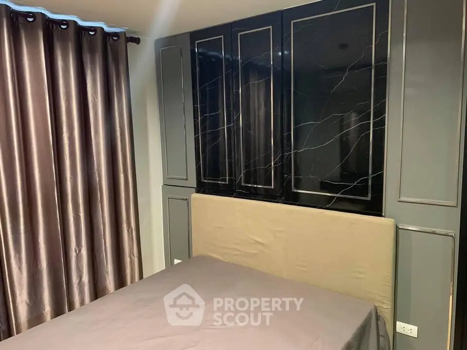 Modern bedroom with elegant curtains and stylish wall paneling