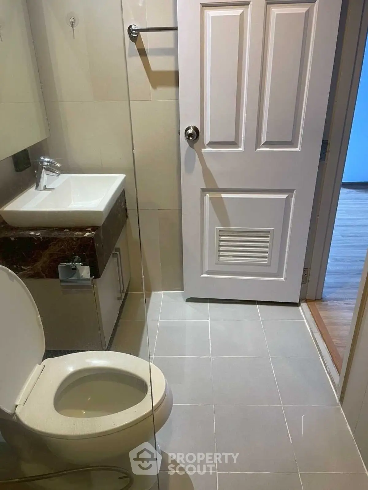 Modern bathroom with sleek fixtures and glass shower enclosure