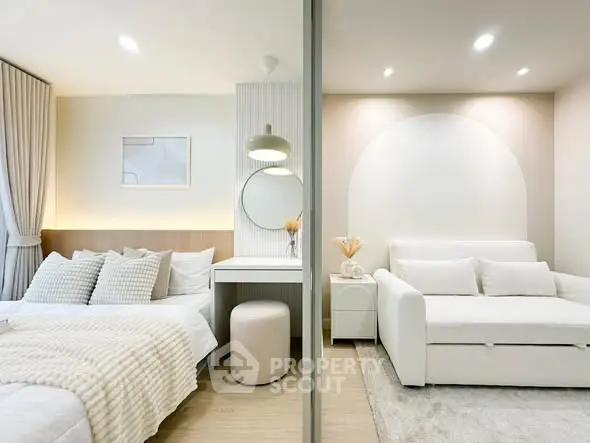 Modern bedroom and living area with stylish decor and neutral tones