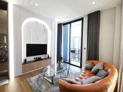 Luxurious living room with modern decor and balcony access in upscale apartment.
