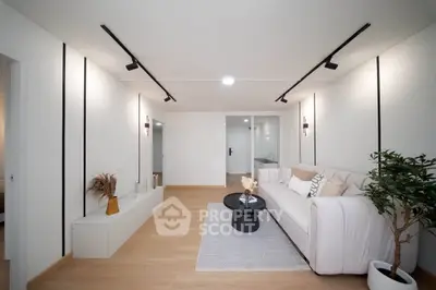 Modern living room with minimalist decor and cozy seating area