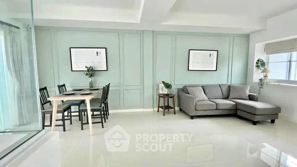 Modern living room with elegant dining area and stylish decor