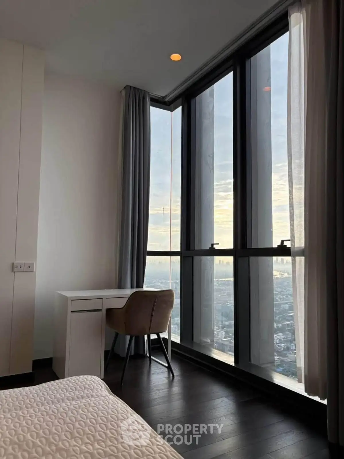 Luxurious bedroom with stunning city view and elegant furnishings