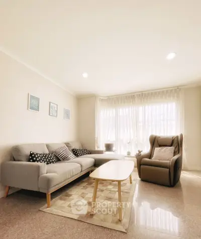 Bright and cozy living room with modern furniture and natural light