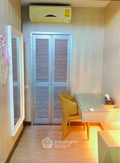 Cozy study room with modern desk and air conditioning