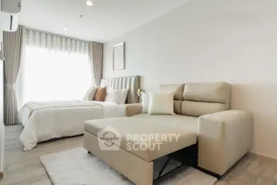 Modern bedroom with stylish decor and comfortable seating area