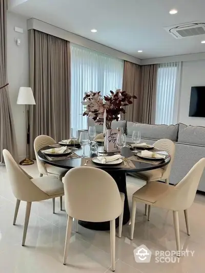 Elegant dining area with modern decor and stylish furniture in a luxurious living space.