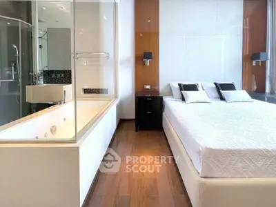 Luxurious bedroom with modern ensuite bathroom and elegant decor