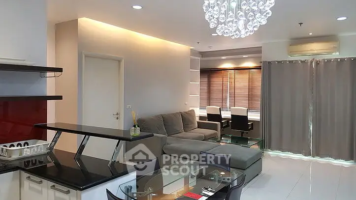 Modern living room with elegant decor and open kitchen layout