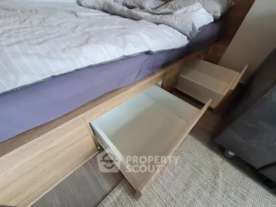 Modern bedroom with under-bed storage drawers and stylish bedding