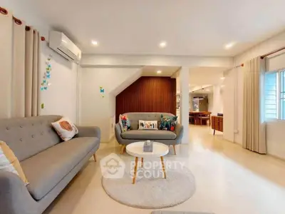Spacious modern living room with stylish furniture and open layout