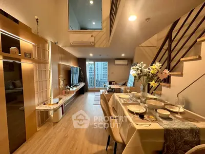 Luxurious modern living room with elegant dining area and stylish decor in a spacious apartment.