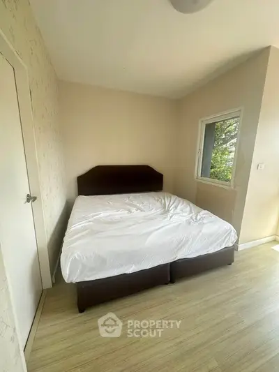 Cozy bedroom with natural light and minimalist decor