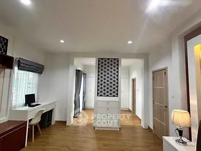 Spacious modern living room with elegant decor and ample natural light