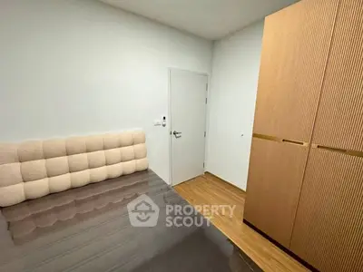 Modern bedroom with sleek wardrobe and stylish headboard