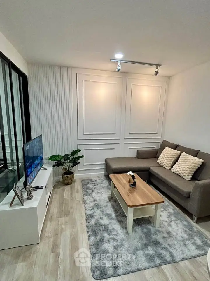 Modern living room with cozy sofa and stylish decor