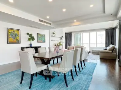 Spacious modern living room with elegant dining area and large windows