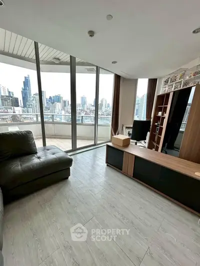 Spacious living room with stunning city view and large balcony access