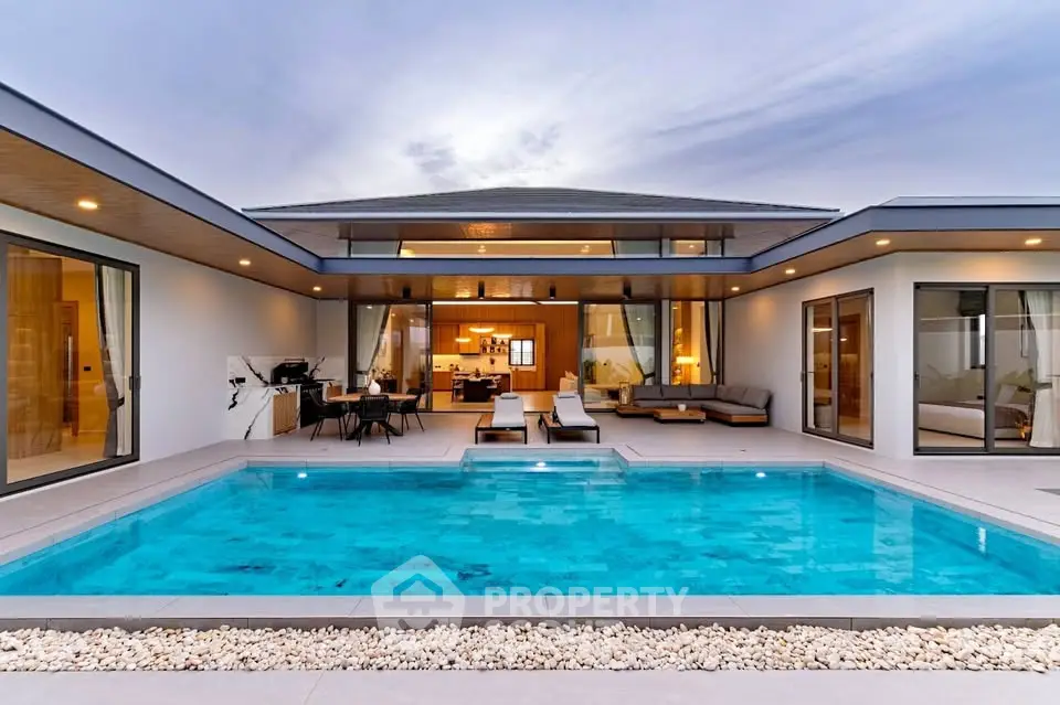 Luxurious modern villa with stunning pool and open living space, perfect for relaxation and entertainment.