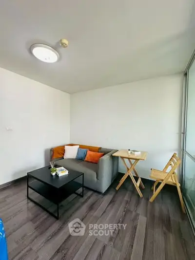 Modern living room with cozy sofa and stylish decor in a bright apartment.
