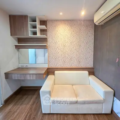 Modern living room with stylish sofa and wall-mounted shelves