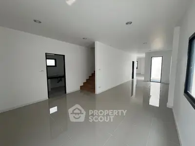 Spacious modern interior with glossy tile flooring and minimalist design