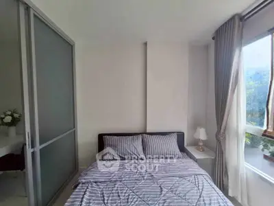 Cozy bedroom with modern decor and large window view