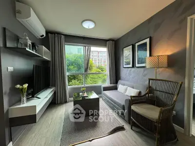 Modern living room with stylish decor and large window view