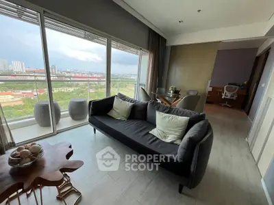 Spacious living room with panoramic city view and modern decor