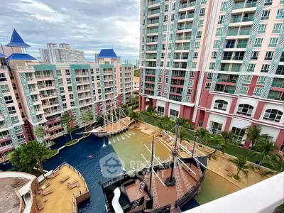 Luxurious condominium complex with unique pirate ship pool and stunning architecture.