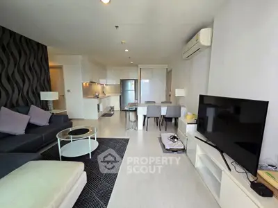 Spacious modern living room with open kitchen and stylish decor