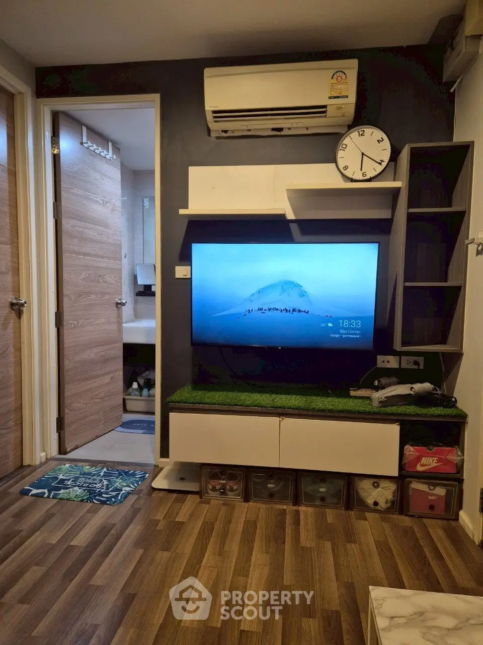 Modern living room with wall-mounted TV and stylish decor