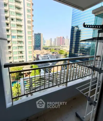 Spacious balcony with stunning city view in modern high-rise apartment