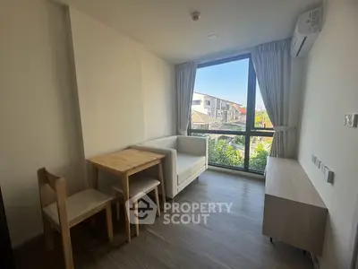 Cozy living room with natural light and modern furniture