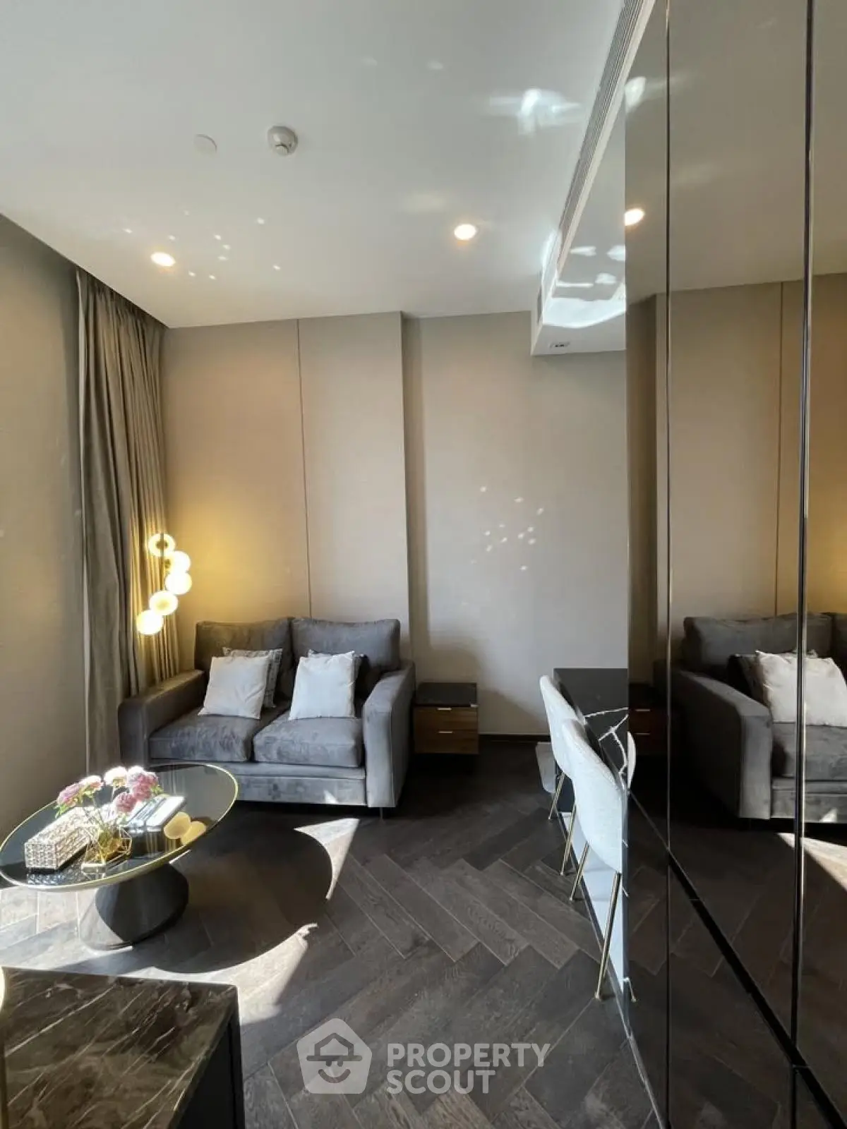 Modern living room with stylish furniture and elegant lighting