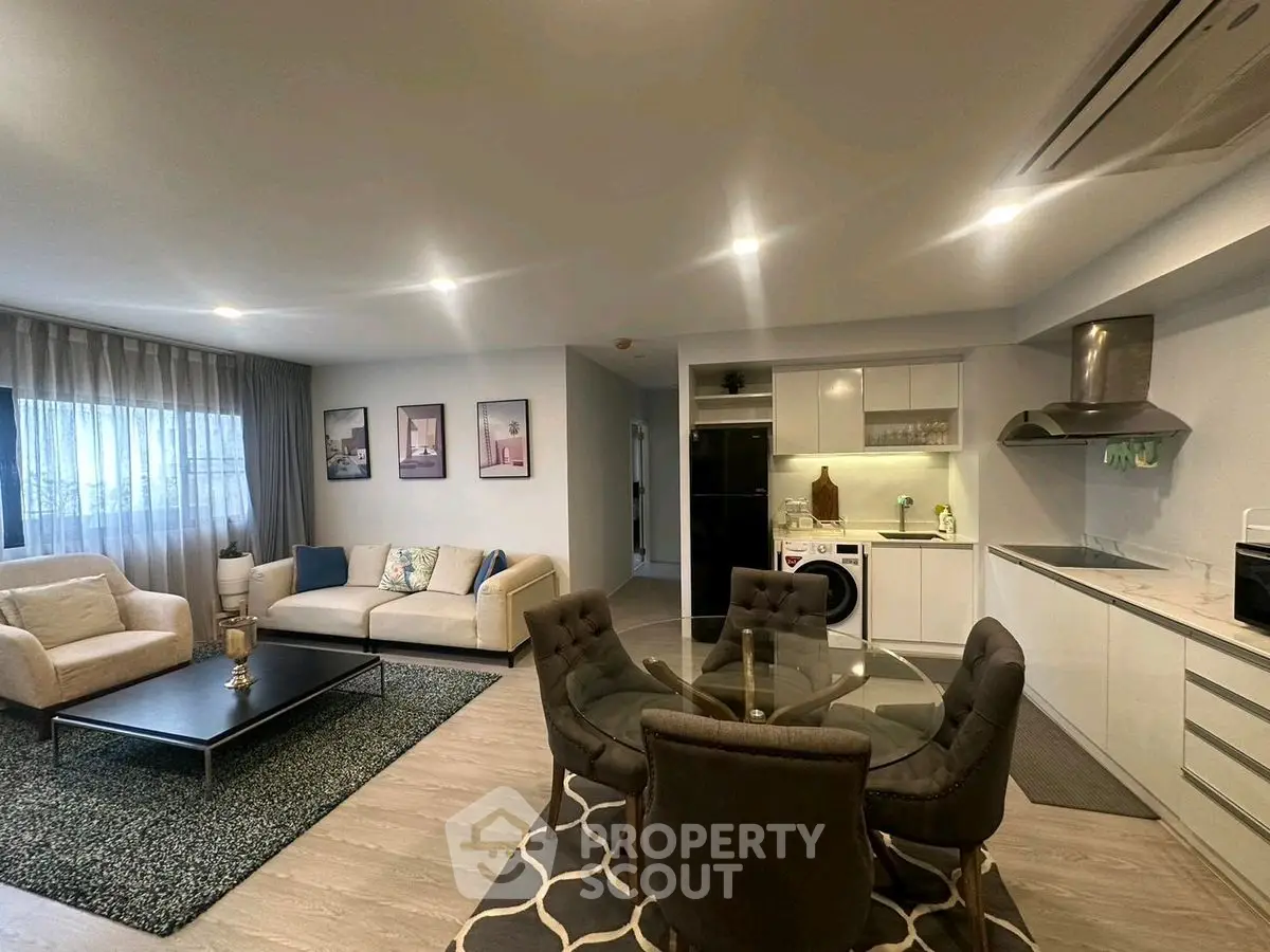 Spacious modern living room with open kitchen and stylish decor
